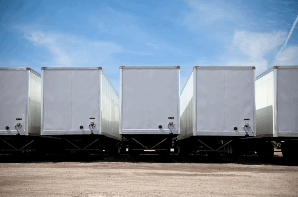 Row of transport truck trailers in a yard